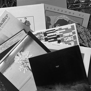 A heap of vinyl recods on a carpet