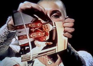 Screen grab of Sinéad O’Connor ripping an image of the pope in pieces.