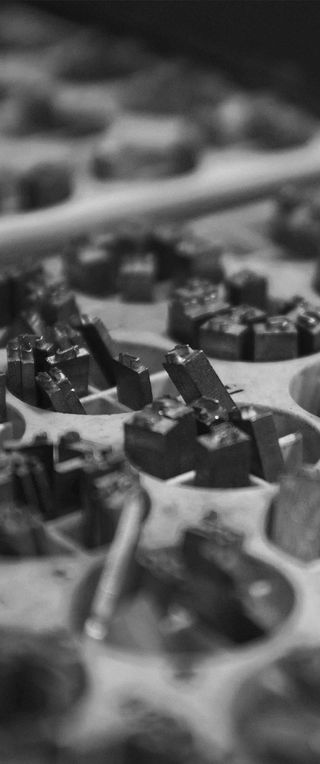 A box of lead letterforms to be used in letterpress printing